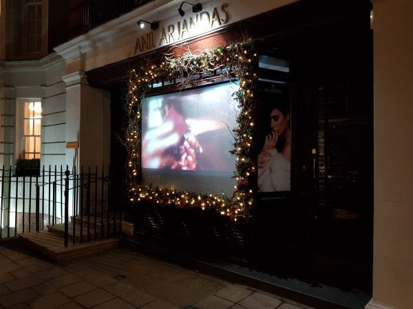 Anil Arjandas enjoy the projection, privacy and security advantages of using a Switchable Projection Screen in their window display