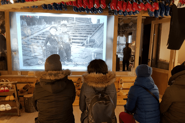 Customers enjoying Switchable projection as part of their customer experience in The Wooden Shoe Factory in Volendam, Netherlands