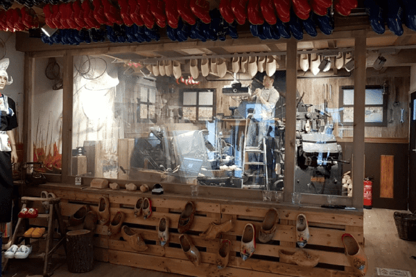 Switchable partition switched on, revealing the authentic Dutch Clog making workshop behind